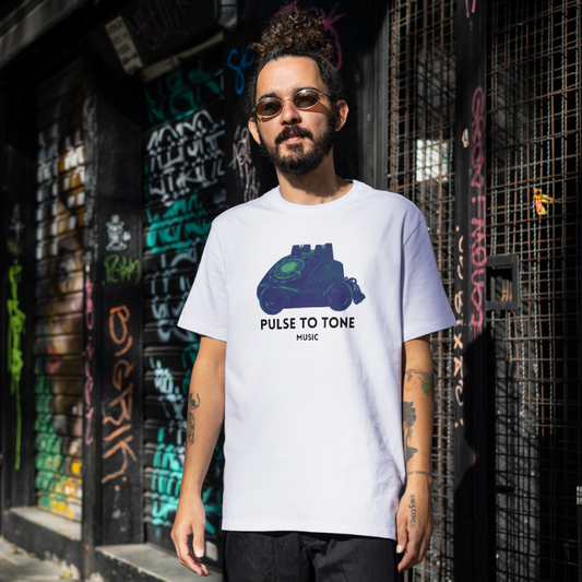 Man wearing a white t-shirt with a graphic design in an urban setting